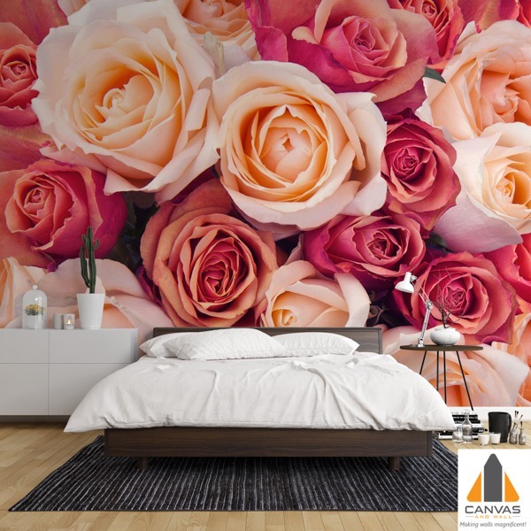 Pink and peach roses wall mural in a modern bedroom, available for wallpaper installations in Gauteng.