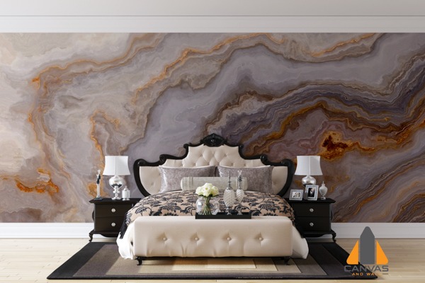 Dramatic marbled custom wallpaper installation in an elegant bedroom with a black and cream bed.