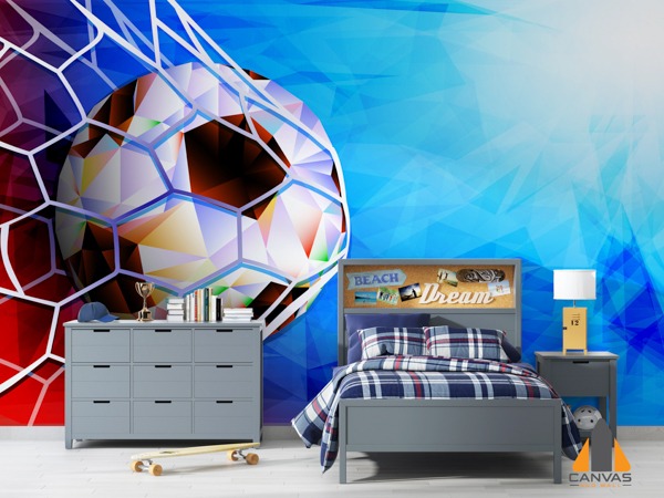 Vibrant soccer ball wall mural in a child's blue and red bedroom with grey furniture.