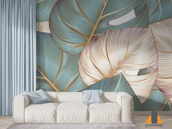 Living room with a large monstera leaf wall mural in teal and gold, installed behind a white sofa.
