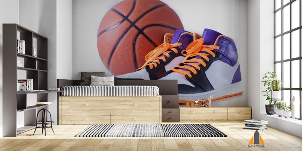 Large basketball and sneakers wall mural in a child's bedroom with shelving and wooden bed.