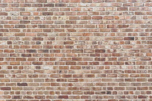 Close-up of a rustic brick wall, perfect for a custom wallpaper design.