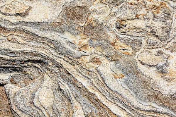 Close-up of a layered rock texture wallpaper design.